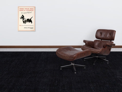 Load image 1 in gallery view. Solid black textured rug in a room with a brown leather lounge chair and vintage dog poster.