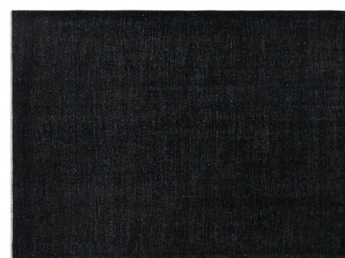 Load image 1 in gallery view. Solid black rug with a subtle, distressed texture and faint tonal variations.