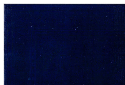 Load image 1 in gallery view. Solid deep navy blue rug with a subtle, distressed texture and faint, scattered white flecks.