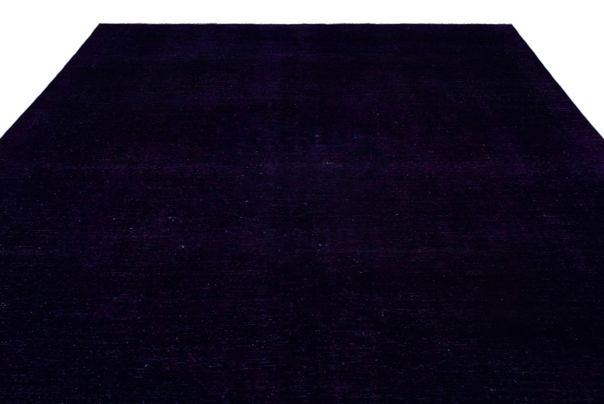 Solid deep purple rug with a subtle, uniform texture on a white background.