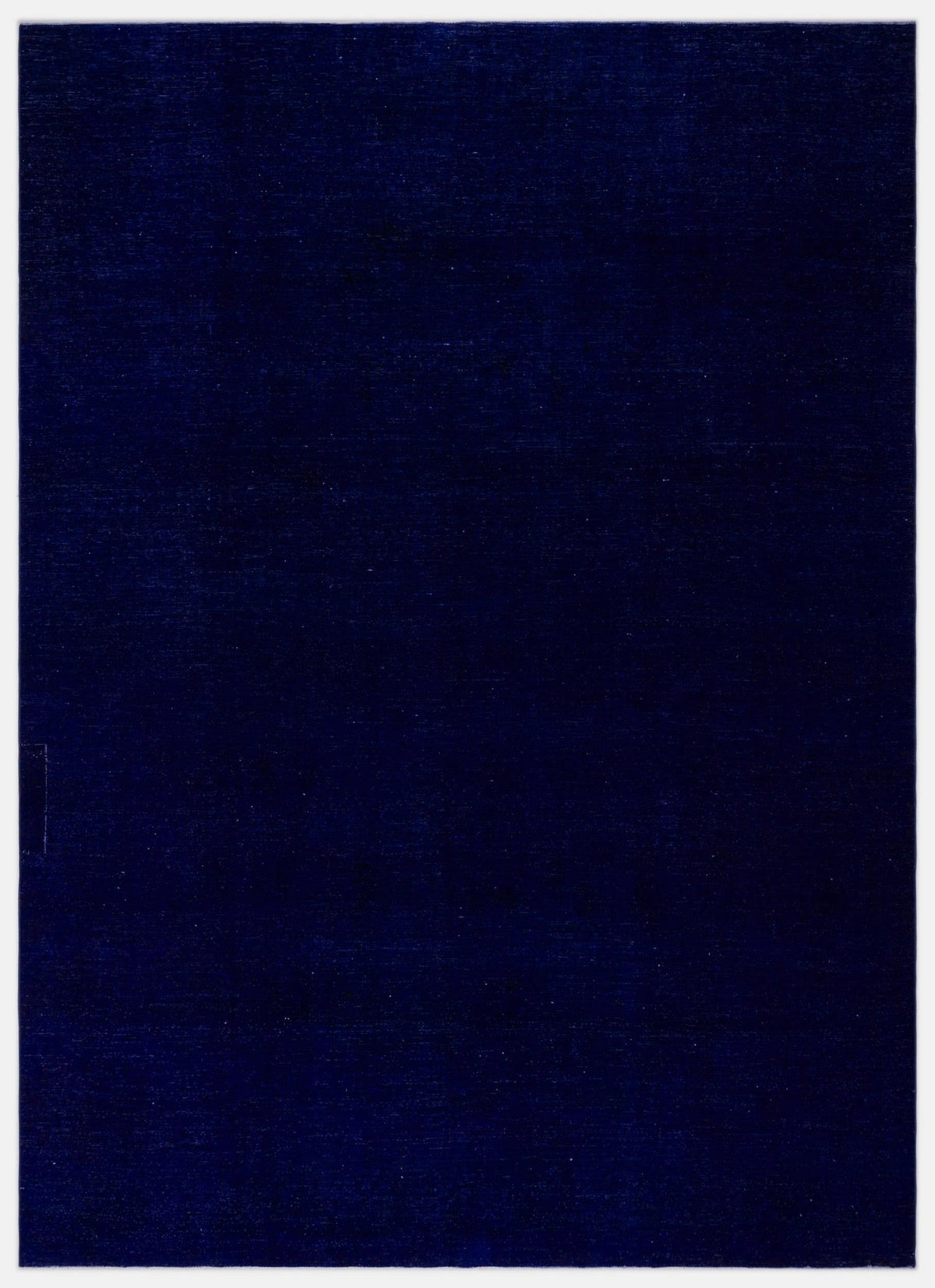 Solid deep navy blue rug with a subtle, uniform texture on a white background.