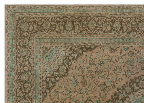 Load image 1 in gallery view. Tan and dark brown traditional rug with a distressed floral medallion pattern and teal accents.