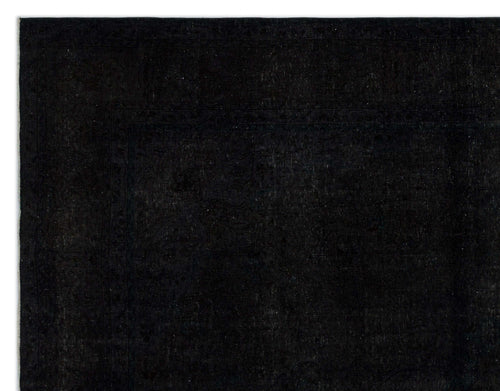 Load image 1 in gallery view. Solid black rug with a subtle, tone-on-tone traditional border pattern.
