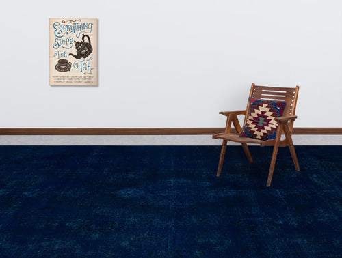 Load image 1 in gallery view. Solid navy blue distressed rug in a room with a wooden chair and tea-themed wall art.