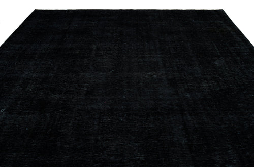 Load image 1 in gallery view. Solid black rug with a subtle, distressed vintage texture on a white background.