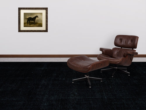 Load image 1 in gallery view. Solid black distressed-texture rug in a room with a brown leather lounge chair and a framed horse print.
