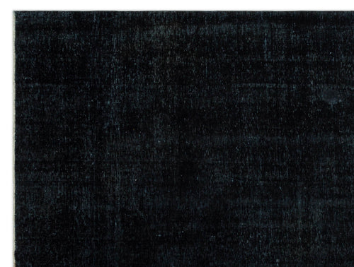 Load image 1 in gallery view. Solid black, low-pile rug with a subtle, distressed texture and faint tonal variations.