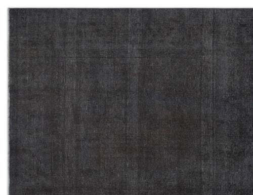 Load image 1 in gallery view. Solid charcoal black rug with a subtle, distressed vintage texture and visible weave.
