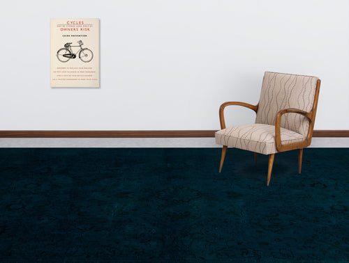 Load image 1 in gallery view. Dark teal rug with a subtle tonal floral pattern, styled in a room with a mid-century armchair and wall art.