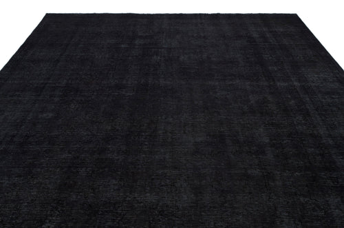 Load image 1 in gallery view. Solid black rug with a subtle, distressed vintage-style pattern and a thin border, isolated on a white background.