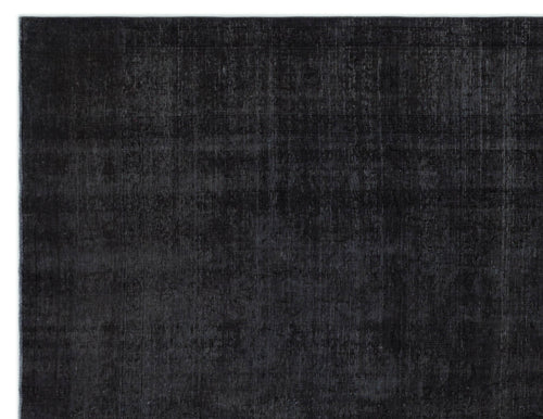 Load image 1 in gallery view. Solid black rug with a distressed, faded texture and subtle tonal variations.