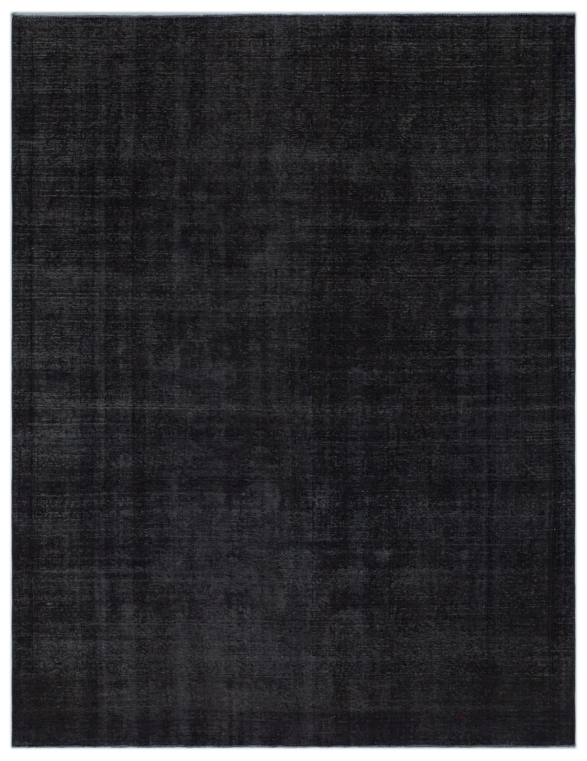 Solid charcoal black rug with a subtle, distressed, and faded texture.