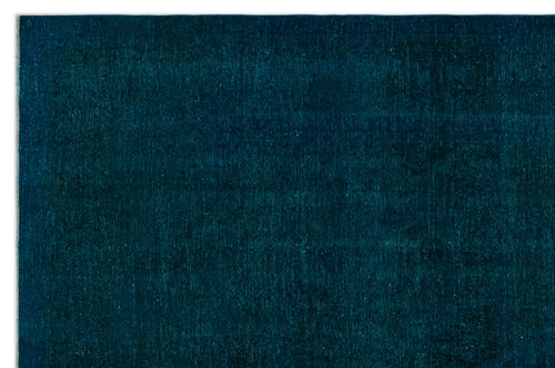 Load image 1 in gallery view. Deep teal monochromatic rug with a subtle, distressed vintage-style pattern.