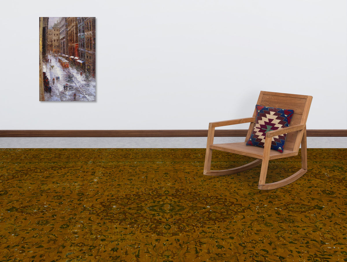 Distressed mustard yellow rug with a dark floral medallion pattern, styled in a room with a wooden rocking chair.