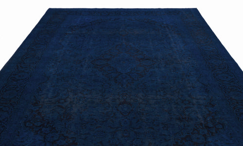 Load image 1 in gallery view. Deep blue traditional rug with a tonal black floral medallion pattern and ornate border on a white background.