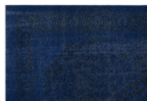 Load image 1 in gallery view. Deep blue and black traditional rug with a distressed floral border and central medallion pattern.