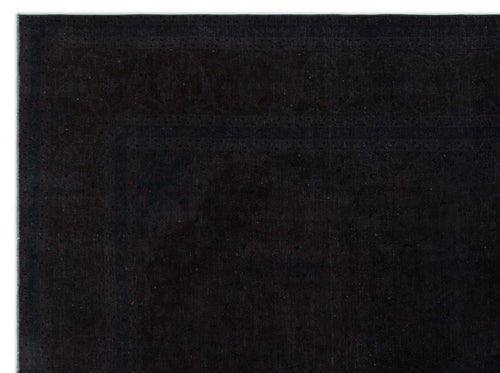 Load image 1 in gallery view. Solid black rug with a subtle, tone-on-tone traditional border pattern on a white background.