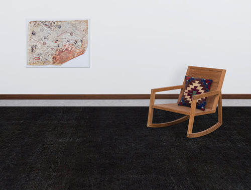 Load image 1 in gallery view. Solid black distressed-texture rug in a room with a wooden rocking chair and a vintage map wall art.