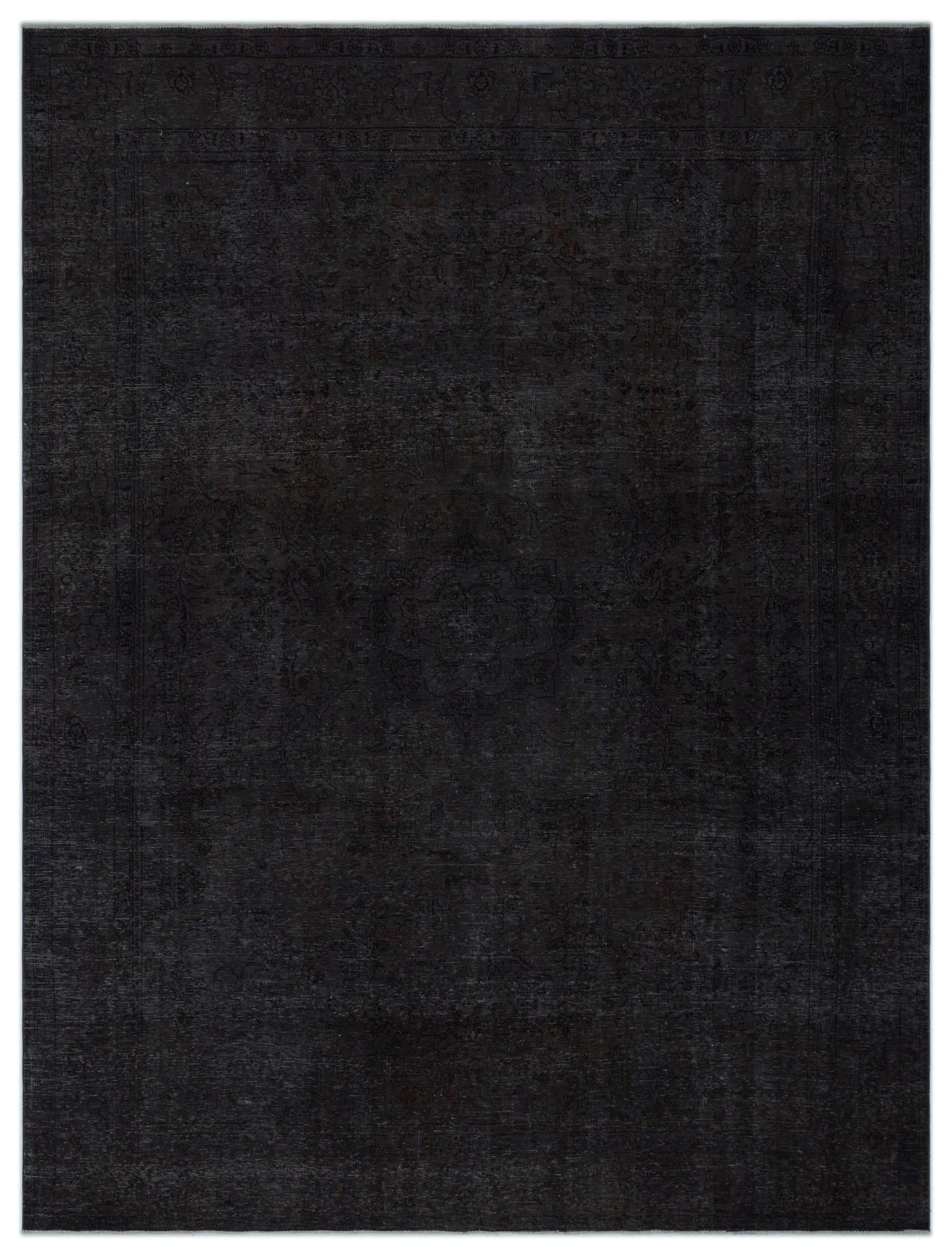 Monochromatic black rug with a subtle, tone-on-tone traditional floral medallion pattern.