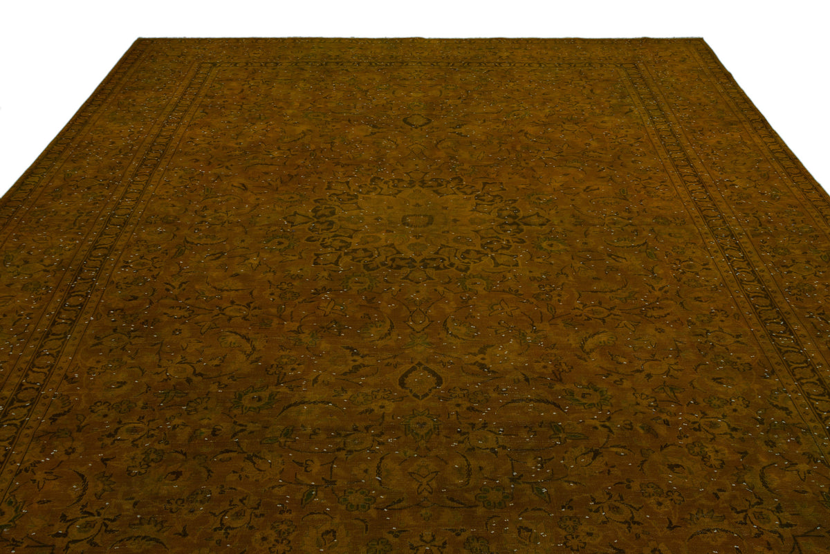 Dark olive green traditional rug with a central floral medallion and intricate border pattern on a white background.