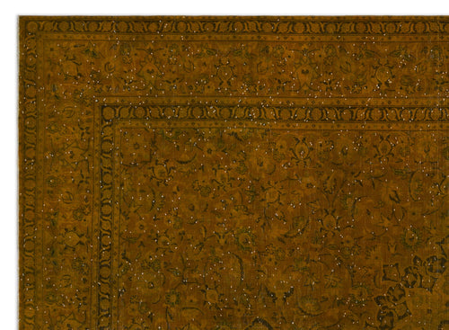Load image 1 in gallery view. Mustard yellow rug with a dark floral pattern and white speckled distressed detailing.