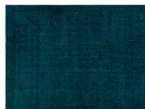 Load image 1 in gallery view. Deep teal vintage-style rug with a subtle, distressed floral medallion pattern and a decorative border.
