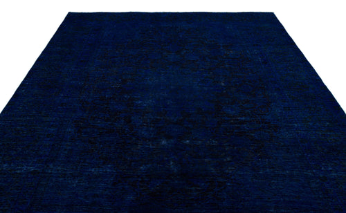 Load image 1 in gallery view. Deep navy blue rug with a subtle, tonal distressed medallion pattern on a white background.
