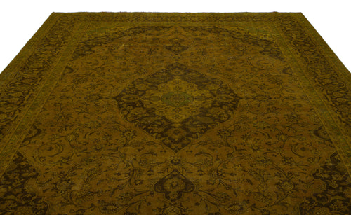 Load image 1 in gallery view. Olive green and dark brown traditional rug with a central floral medallion and intricate vine-scroll border.