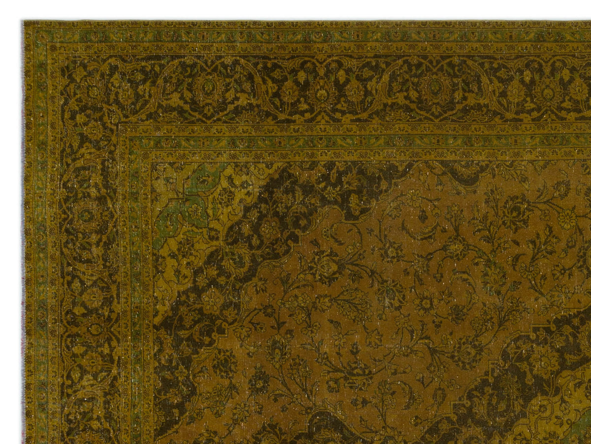 Olive and dark brown traditional rug with an intricate floral medallion pattern and a wide decorative border.