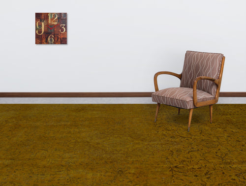 Load image 1 in gallery view. Solid mustard yellow rug with a subtle, tonal traditional pattern, styled in a room with a patterned armchair and clock.