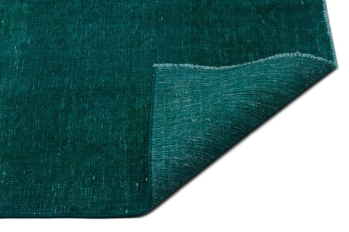 Load image 1 in gallery view. Solid teal distressed-texture rug with a folded corner revealing the underside, isolated on a white background.