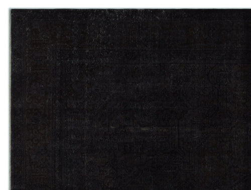 Load image 1 in gallery view. Black monochromatic rug with a subtle, distressed traditional Persian-style pattern and a wide border.