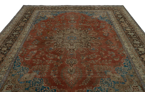 Load image 1 in gallery view. Terracotta, blue, and beige traditional rug with a central floral medallion and intricate border on a white background.