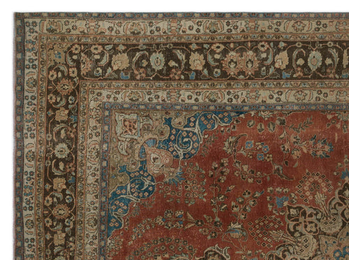 Load image 1 in gallery view. Traditional Persian-style rug with a terracotta field, blue floral motifs, and a dark brown border with cream accents.