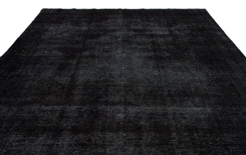 Load image 1 in gallery view. Solid black rug with a distressed, low-pile texture and subtle tonal variations.