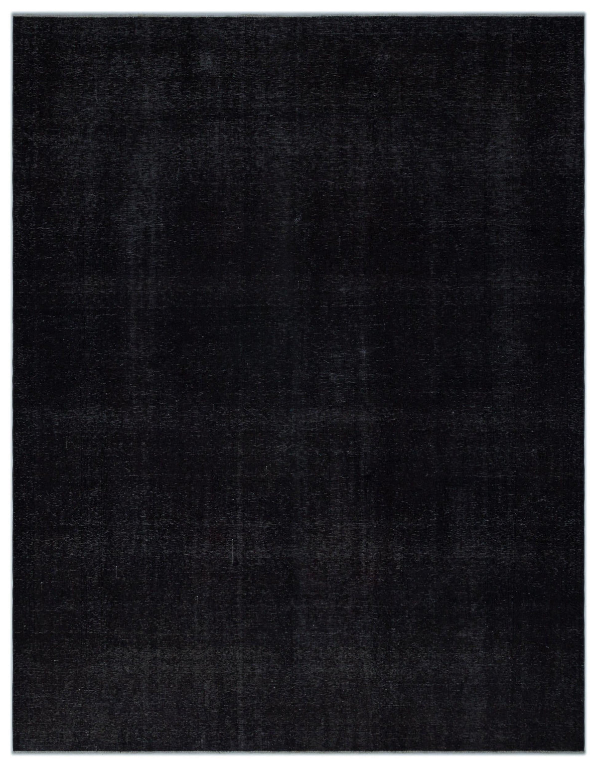 Solid black rug with a subtle, distressed vintage texture on a white background.