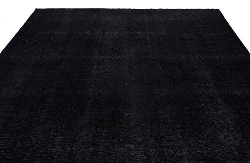 Load image 1 in gallery view. Solid black rug with a subtle, distressed vintage texture on a white background.