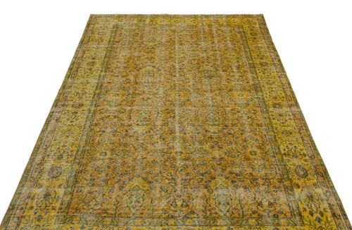 Load image 1 in gallery view. Mustard yellow and olive green vintage-style rug with a distressed traditional floral medallion pattern.