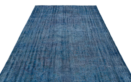 Load image 1 in gallery view. Blue distressed-style rug with a textured, monochromatic abstract pattern on a white background.