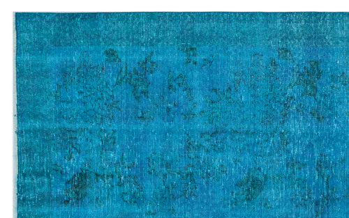 Load image 1 in gallery view. Teal distressed rug with a faint, tonal floral medallion pattern.