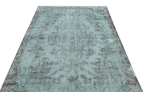 Load image 1 in gallery view. Distressed light blue and grey vintage-style rug with a faded floral medallion pattern on a white background.