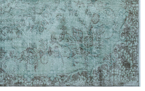Load image 1 in gallery view. Teal and charcoal distressed rug with a faded traditional floral medallion pattern on a white background.