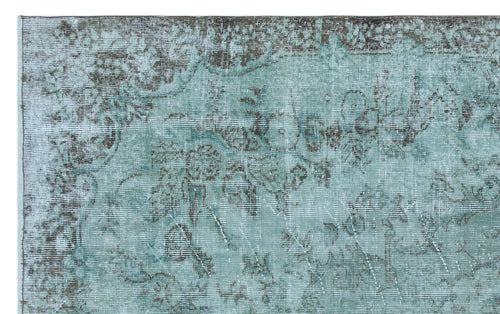 Load image 1 in gallery view. Distressed teal and charcoal rug with a faded traditional floral medallion pattern.