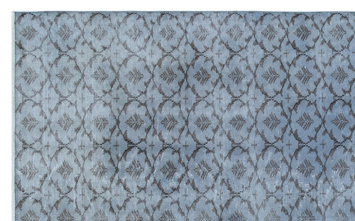 Load image 1 in gallery view. Slate blue rug with a dark grey repeating lattice and floral medallion pattern.