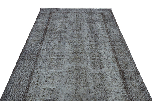 Load image 1 in gallery view. Grey and brown distressed vintage-style rug with a faded floral medallion pattern and a dark border.
