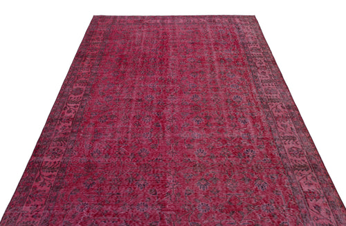 Load image 1 in gallery view. Deep red vintage-style rug with a faded floral medallion pattern and a dark decorative border.