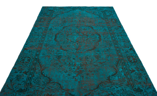 Load image 1 in gallery view. Teal and black distressed rug with a central floral medallion and ornate border pattern on a white background.