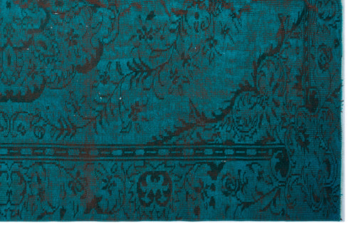 Load image 1 in gallery view. Teal and black distressed rug with an ornate traditional floral pattern and a geometric border.
