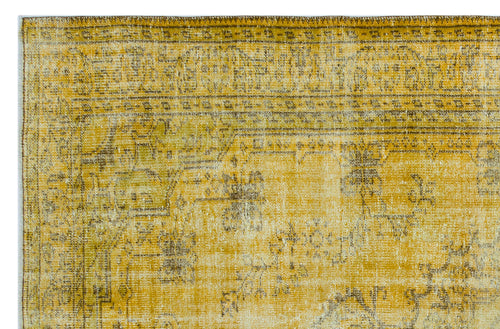 Load image 1 in gallery view. Mustard yellow and brown distressed rug with a faded traditional medallion pattern on a white background.