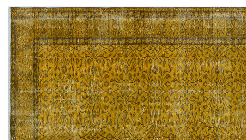 Load image 1 in gallery view. Mustard yellow and brown distressed rug with a traditional floral pattern and a bordered edge.